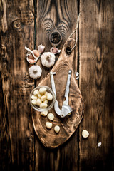 Garlic background . Fresh garlic on old wooden Board.