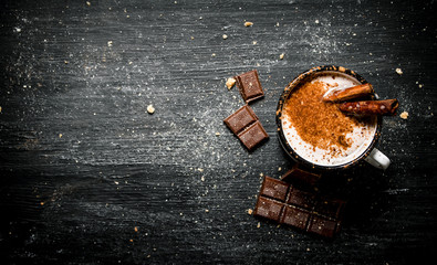 Aromatic cocoa drink with cinnamon and chocolate.