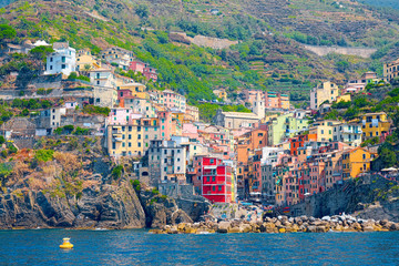 Riomaggiore from the sea, the village of 5 Terre, colored houses