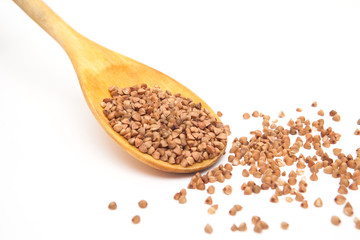 buckwheat grain in the wood spoon