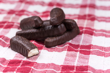 Chocolate bananas on the kitchen tablecloth