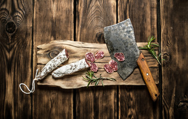 Slicing salami the old hatchet.