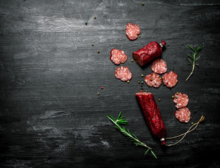 Salami with fresh rosemary and spices.