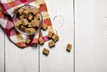 Brown sugar in a Cup on the napkin.