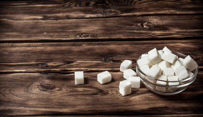 Obraz na płótnie Canvas White refined sugar in the Cup.