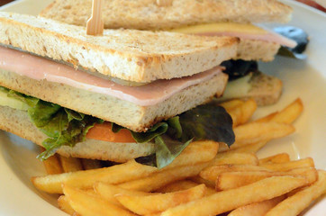 Club sandwiches with fries..