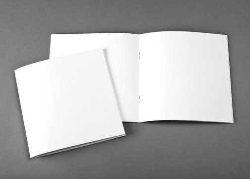 Blank opened magazine isolated on grey background with soft shadow