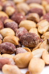 Top macro view of roasted pile of peanuts