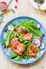 Salmon with spinach and pomegranate  salad by sea salt