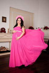 beautiful pregnant woman in pink