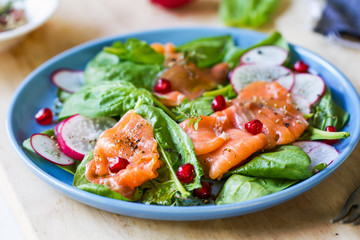 Salmon with spinach and pomegranate  salad