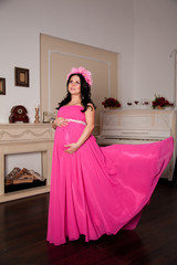 beautiful pregnant woman in pink