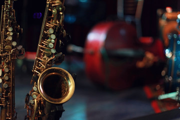 Saxophone on the stage - obrazy, fototapety, plakaty