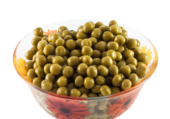 Green peas in a dish on a white background