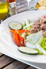 Tuna salad on porcelain plate.