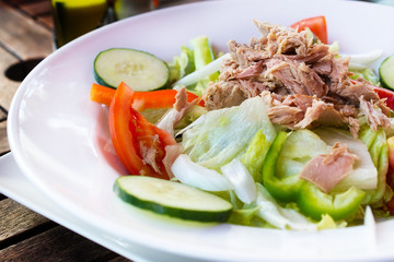 Tuna salad on porcelain plate.