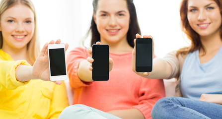 close up of women or friends with smartphones