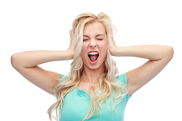 young woman holding to her head and screaming