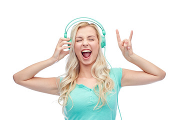 Fototapeta premium happy young woman or teenage girl with headphones