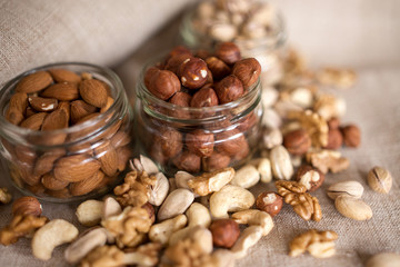 Almonds, walnuts and hazelnuts in glass jar