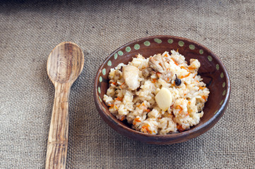 Rice with meat, garlic, spices and vegetables