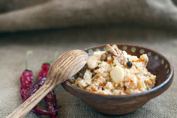 Rice with meat, garlic, spices and vegetables