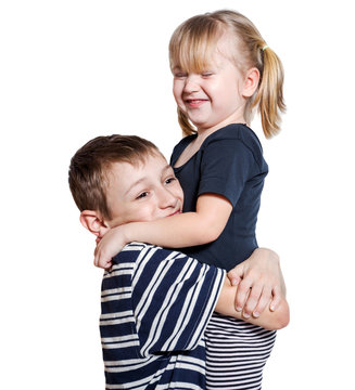 Loving Brother And Little Sister Hugging Isolated Over White