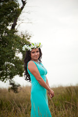 beautiful girl walking in a field