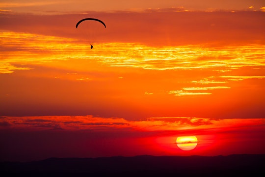 Paragliding in sunset
