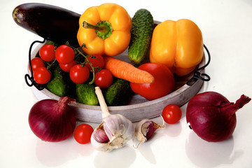Composition with assorted raw organic vegetables wooden table