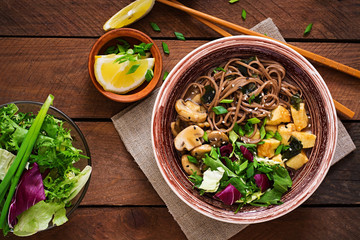 Miso and soba noodle soup with roasted  tofu and  mushrooms. Top