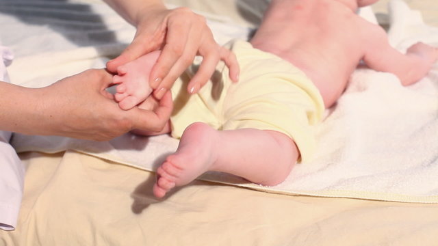 doctor doing massage beby legs