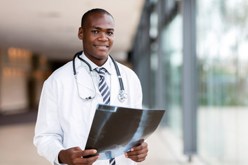 african american male doctor holding x ray