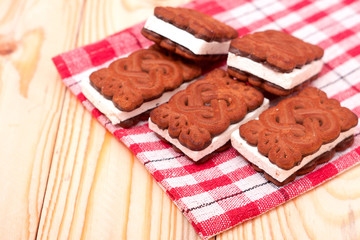coockies with zephyr layer on wooden background