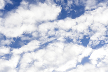 cirrus clouds against the blue sky background