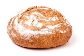 loaf of freshly baked bread floured on white background