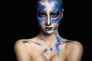 girl in blue paint on his face