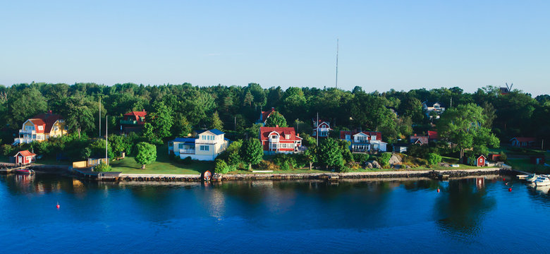 Beautiful super wide-angle panoramic aerial view of Stockholm archipelago, Sweden with harbor and skyline with scenery beyond the city, seen from the ferry, sunny summer day with blue sky