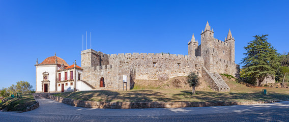 Fototapeta na wymiar Santa Maria da Feira, Portugal - October, 2015: The Feira Castle with Nossa Senhora da Esperanca Chapel on the left.
