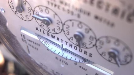 Electrical meter outside of house rotating, showing the energy usage of the home.