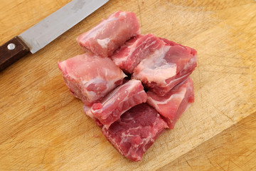 Raw pork ribs on a cutting board - close up