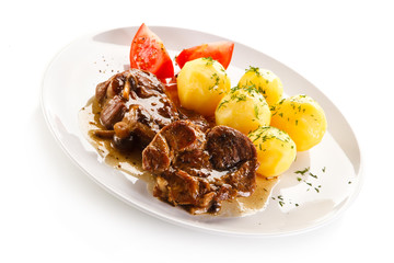 Roast steaks, boiled potatoes and vegetable salad 
