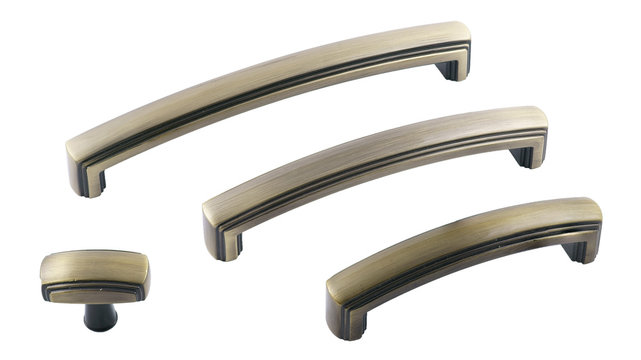 classic set of furniture handles in bronze on a white background
