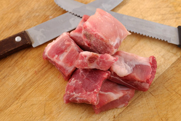 Raw pork ribs on a cutting board - close up