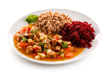 Roasted meat, white grits and vegetables 