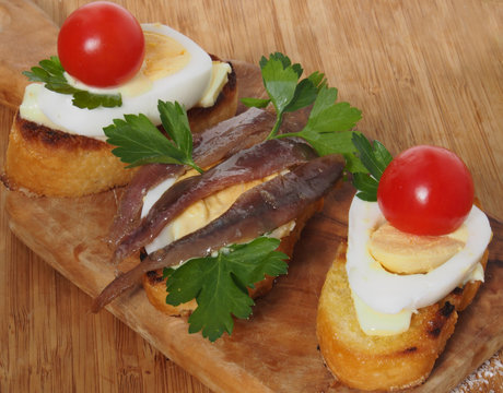 Crostini with anchovy end egg - small sandwich