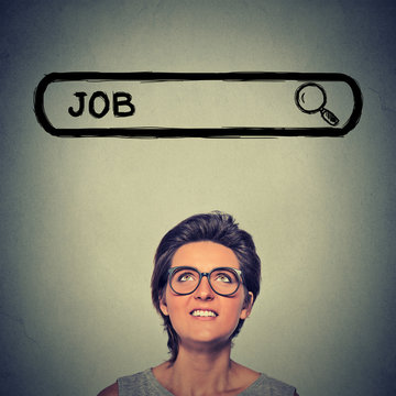 young woman in glasses smiling looking for a new job