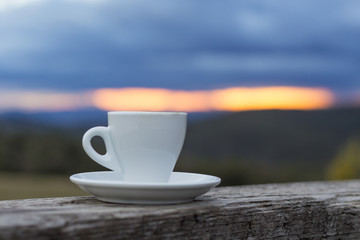 Coffee cup put on the wooden fence
