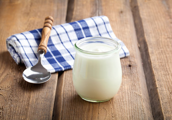 Delicious, nutritious and healthy yogurt in a glass jars with sp