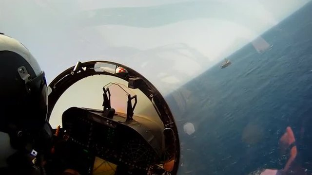 POV shots from the cockpit of a fighter plane.